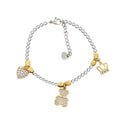 ARMBAND MET KOGELS, KORRELS EN BEDELS GEELGOUD